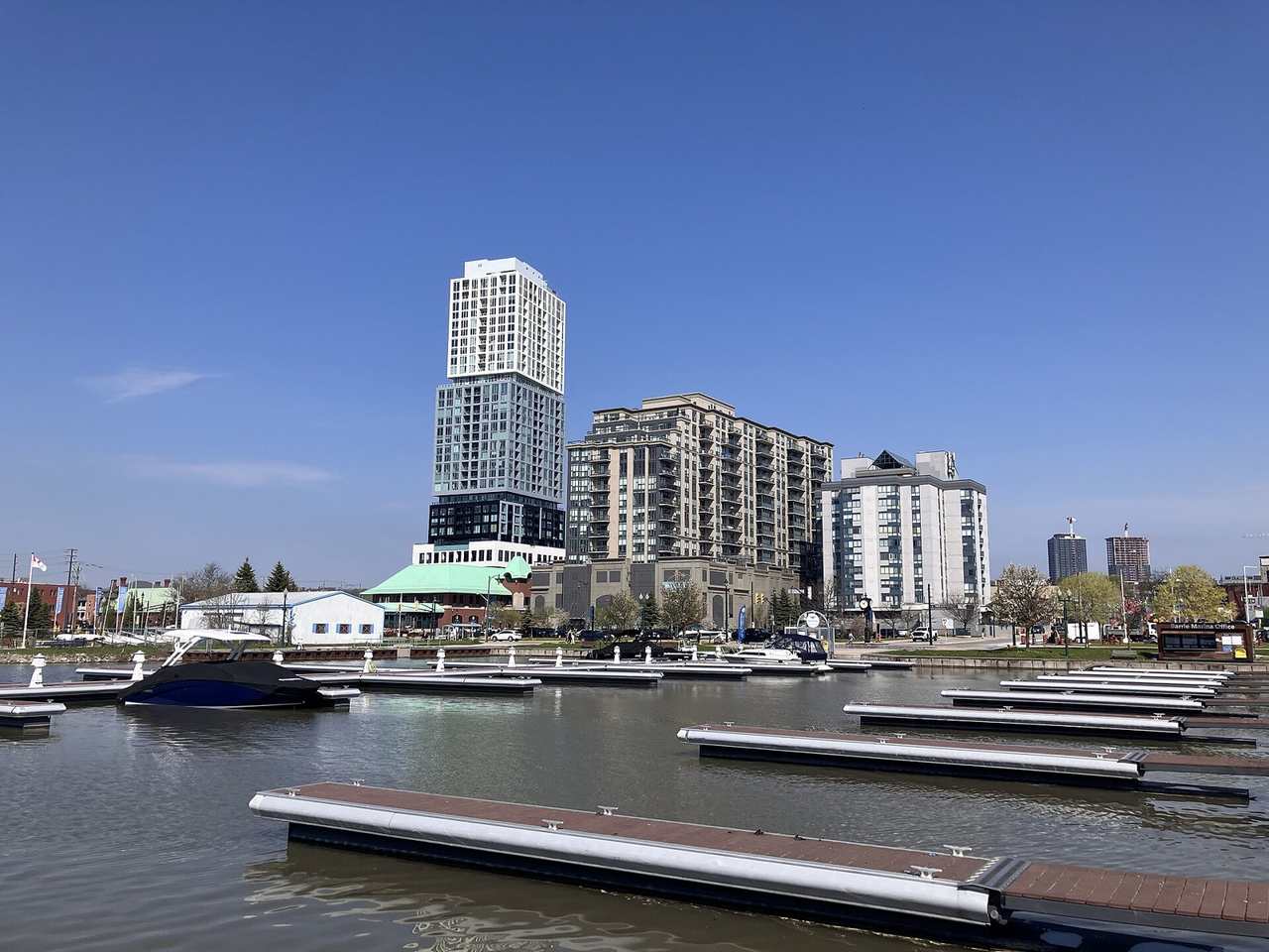 Boats in the Barrie marina below waterfront condo towers on Kempenfelt Bay